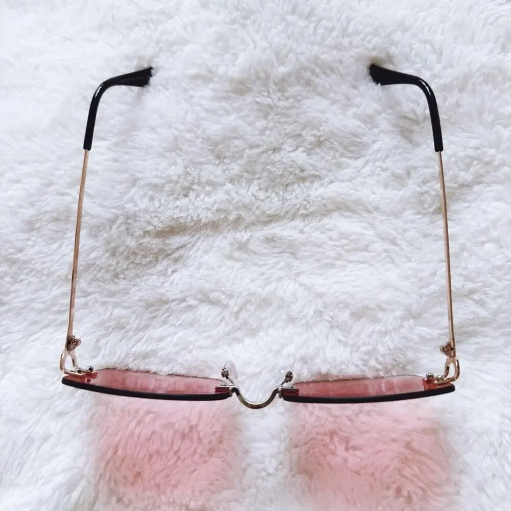 Laurel Clear Orange Rimless Sleek Sunglasses